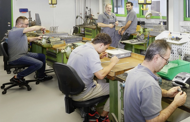 Surgical instrument maker carrying out expert assembly of surgical instruments at Erchinger