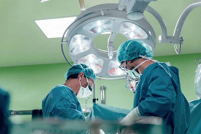 Surgical team in theatre using an Erchinger instrument